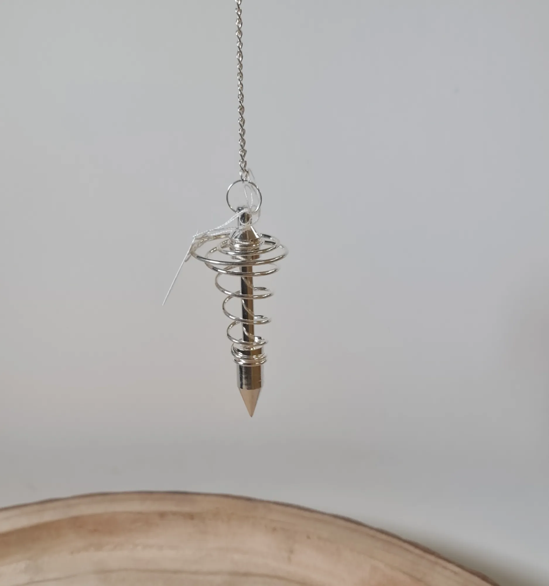 Péndulo espiral bañado en plata
