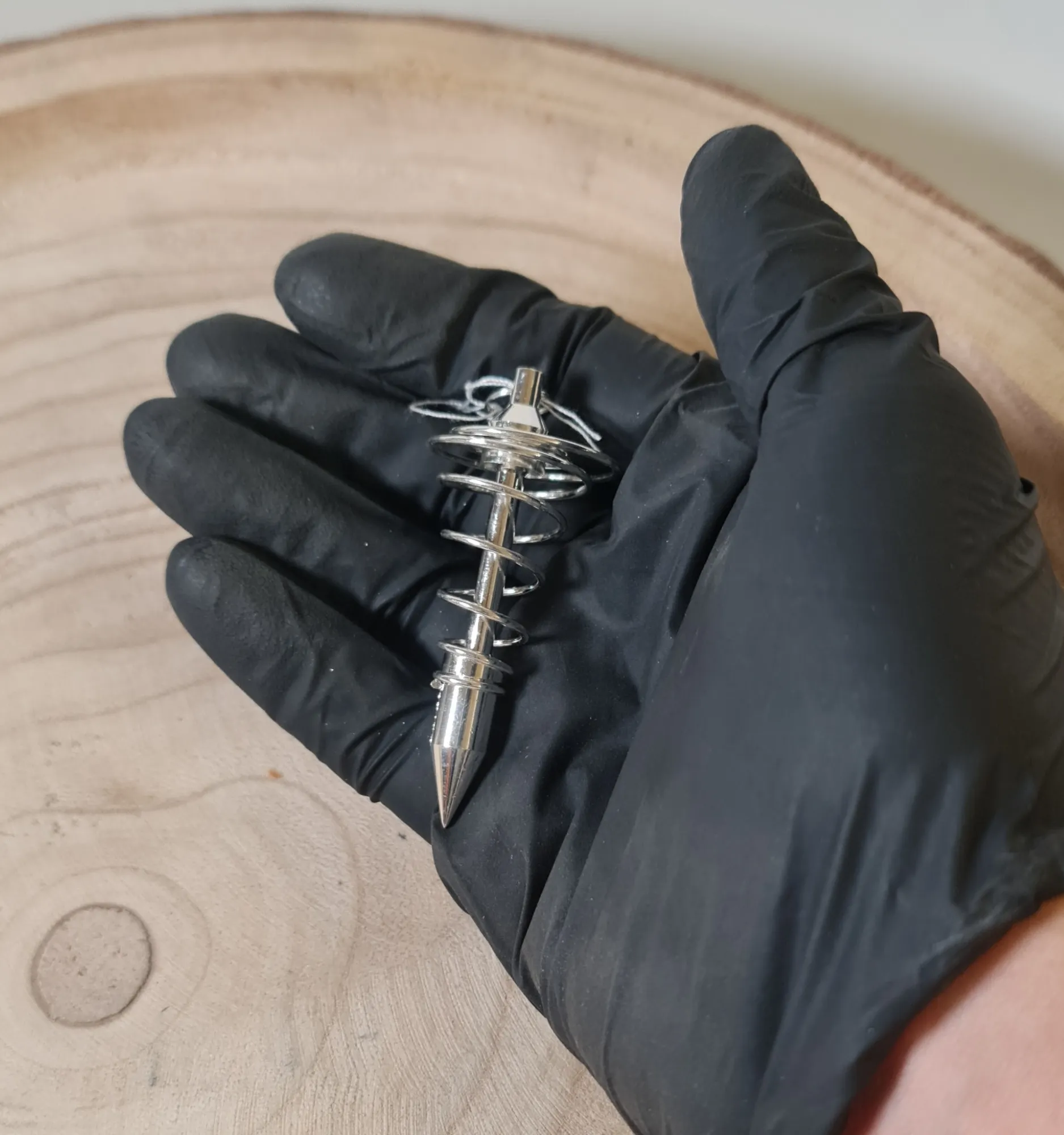 Péndulo espiral bañado en plata