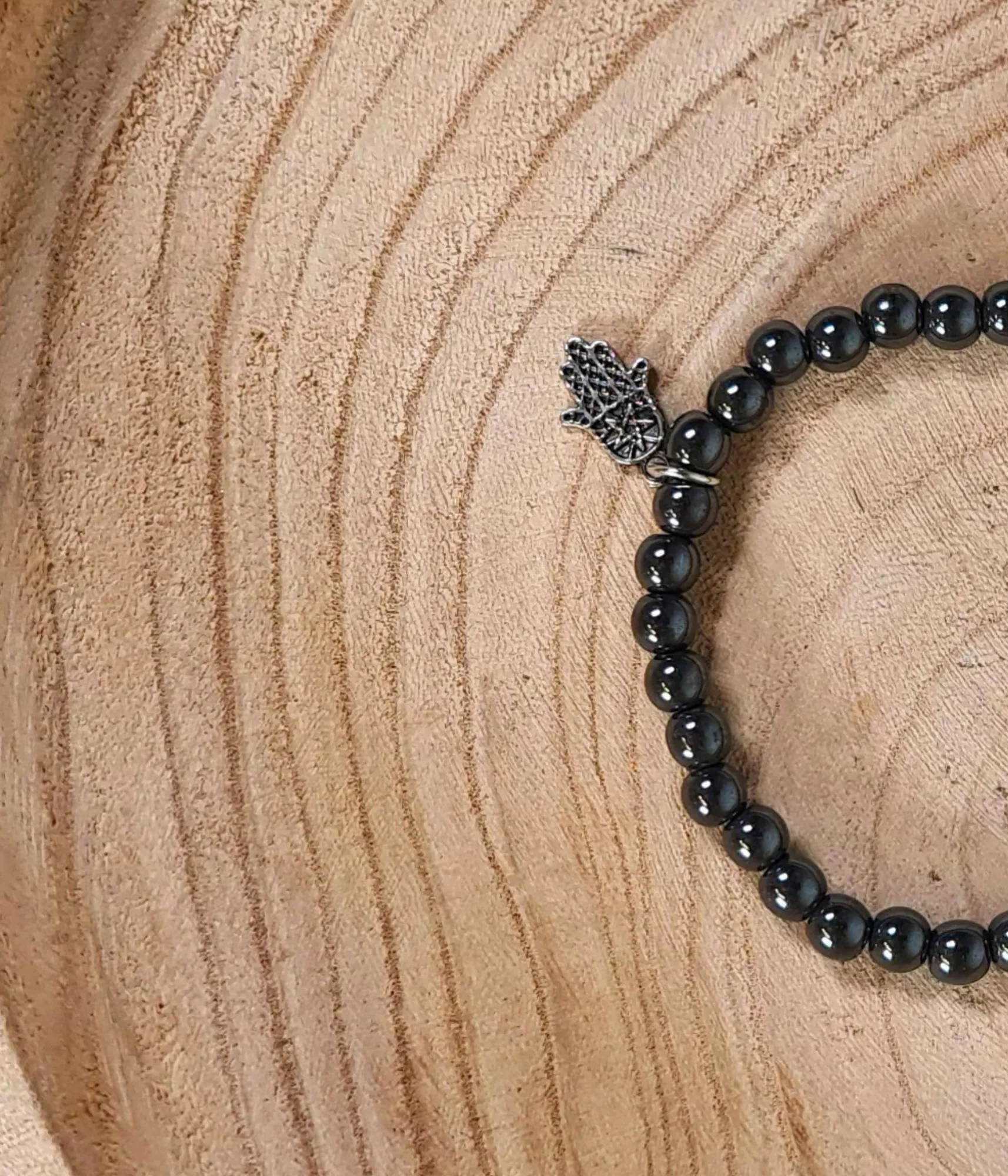 Pulsera Hematita 8mm con Mano de Fátima